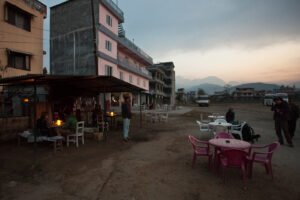 Tourist buses parked at the bus station in Pokhara at dawn, the depot that has fallen largely deserted since the Krishnabhir collapse idled the Pokhara-Kathmandu fleet