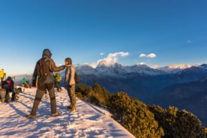 Trekkers walking the Ghorepani Poon Hill trail in the Annapurna region of Nepal in autumn light
