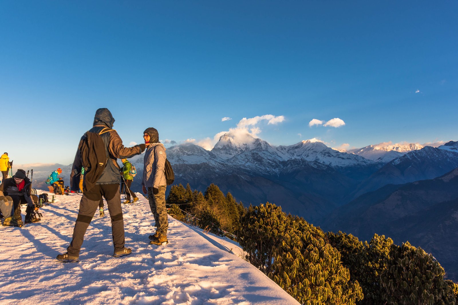 Trekkers walking the Ghorepani Poon Hill trail in the Annapurna region of Nepal in autumn light