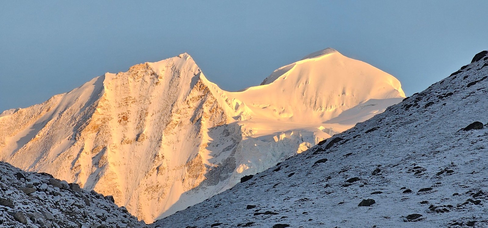 Prayer flags and rocky trail near Larkya La (Larke Pass) on the Manaslu Circuit trek in Gorkha district, Nepal